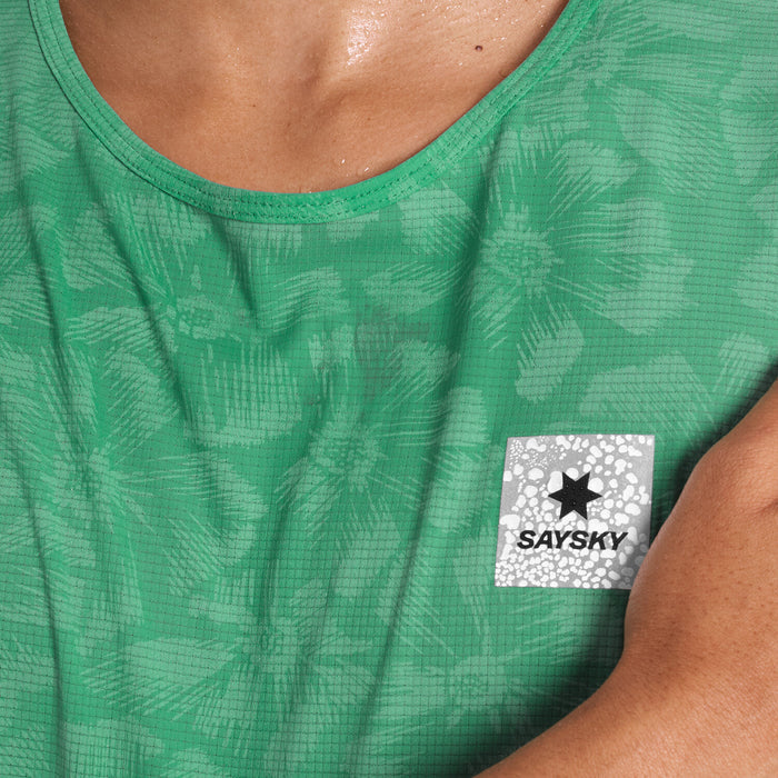 Close up of green SAYSKY Reactive run tee shirt, that displays a flower pattern when wet