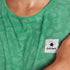 Close up of green SAYSKY Reactive run tee shirt, that displays a flower pattern when wet