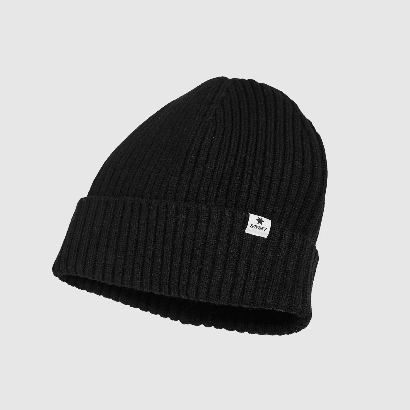 Black knit beanie with a small white SAYSKY logo on a light gray background