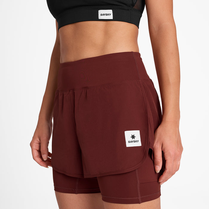 saysky pace 2 in 1 short for women, 3 inch running short with side phone pocket, dark red colour, woman wearing maroon saysky running short