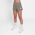 woman wearing saysky pace 3 inch short for women in taupe colour