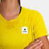 woman wearing saysky run tee in yellow colour, with logo at front