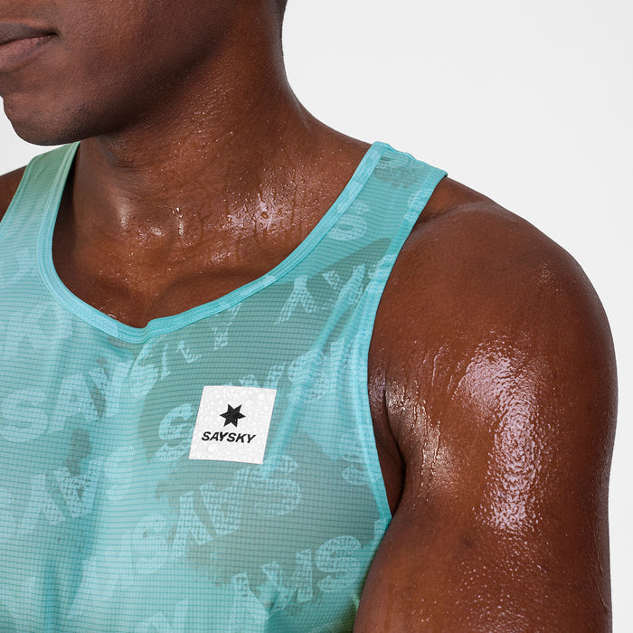 mens light blue saysky singlet with reactive fabric that shows saysky pattern when wet, wet fabric close up on logo