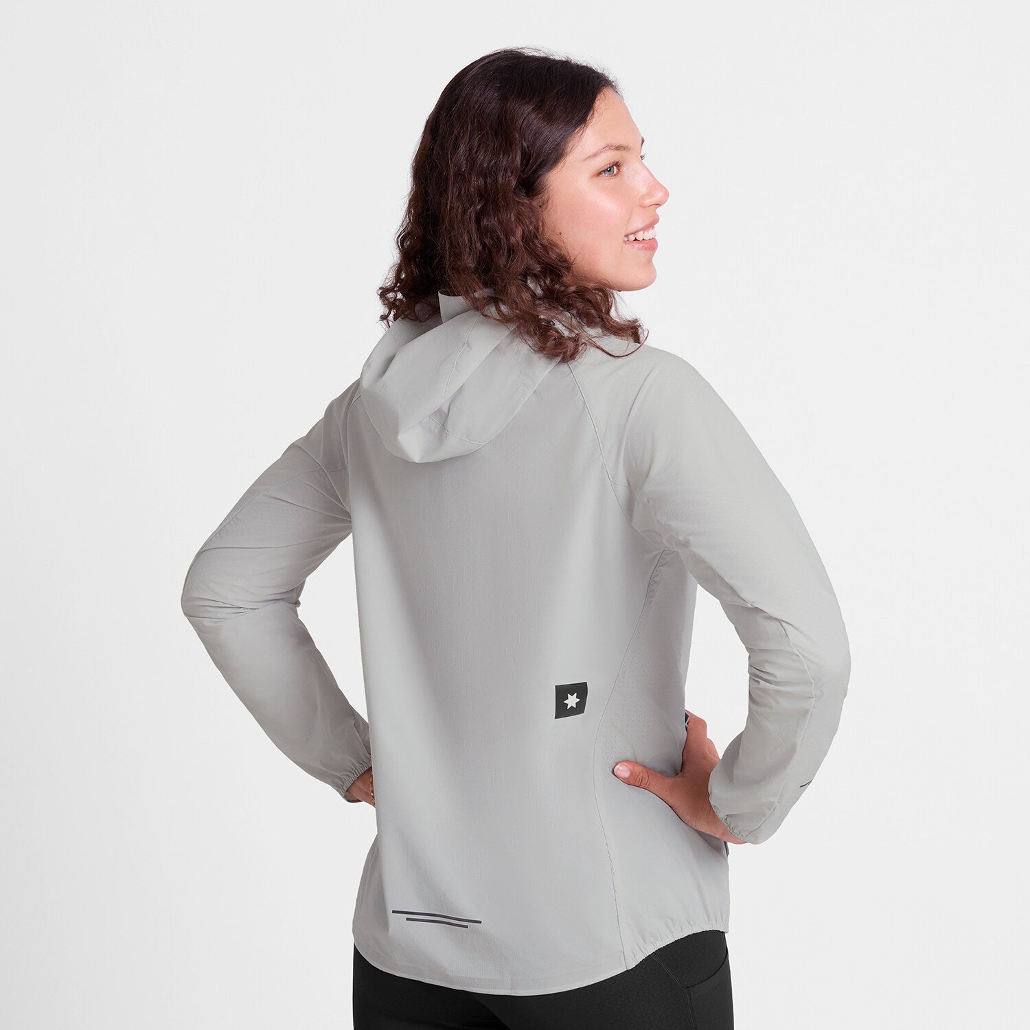saysky womens pace flex hooded jacket sleeve, Wind-resistant, breathable jacket for running, light grey colour, back view of woman wearing saysky grey jacket