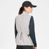 SAYSKY womens clean pace flex vest, lightweight, windproof zip-up running vest for women, grey colour with black SAYSKY logo, back profile of women wearing vest with black longsleeve and cap on a white background