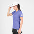 saysky clean pace t-shirt for women, quick dry, soft running t-shirt, light purple colour,  full body view of woman wearing saysky running top with a white cap and black shorts on a white background