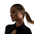 Woman wearing a black wireless shokz earbud