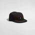 vaga pacer cap, lightweight packable water resistant running cap, black brown and dark grey colour, side angle of hat