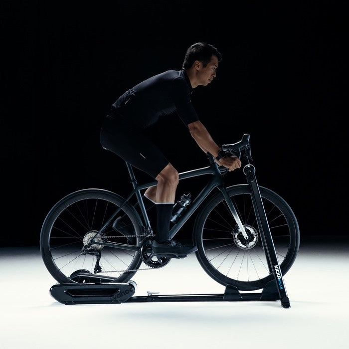 man cycling on wahoo kickr rollr, smart bike roller for indoor cycling