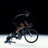 wahoo kickr smart trainer, indoor cycling trainer, black colour, person cycling with trainer attached to back of bike