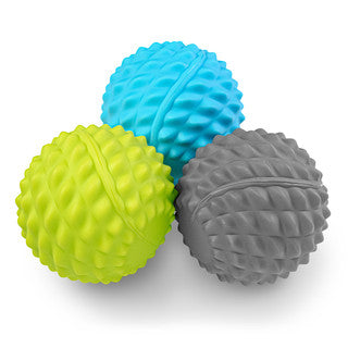 Three textured fitness mad massage balls in lime green, light blue, and gray, arranged together on a white background.
