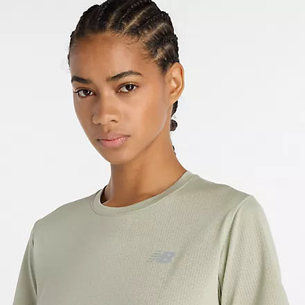 new balance short sleeve shirt for women, lightweight breathable tshirt, light green colour, close up of short neckline on model with reflective nb logo