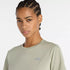 new balance short sleeve shirt for women, lightweight breathable tshirt, light green colour, close up of short neckline on model with reflective nb logo