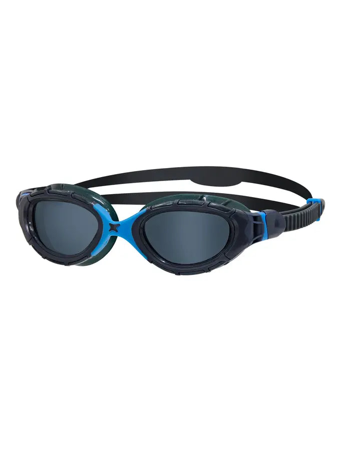 Zoggs Predator Flex swim goggles with a dark green and black camouflage pattern frame, blue accents, and dark gray lenses, shown on a plain white background.