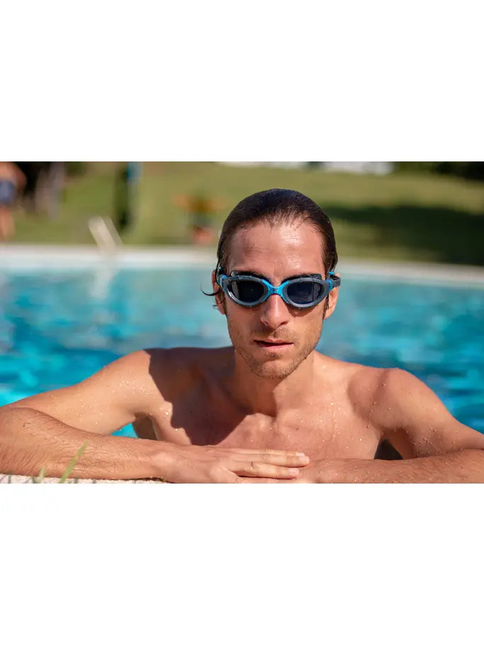 Man wearing Zoggs predator flex swim goggles with tinted lens in pool
