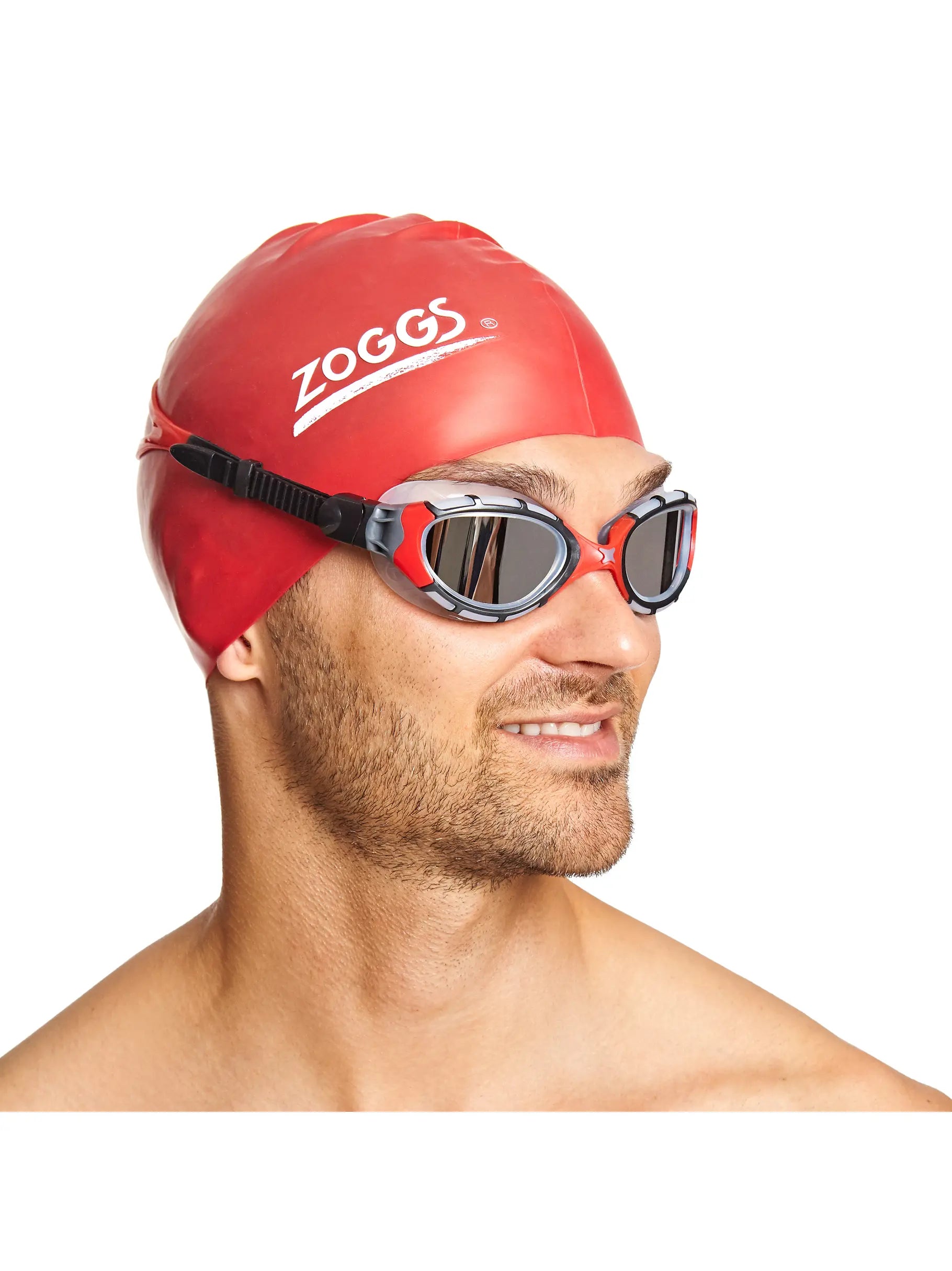 man wearing Zoggs predator flex titanium goggles, clear gasket, red strap and nose bridge, smoke lens